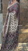 Product video showcasing a premium Ajrakh inspired Modal Silk saree with real mirror work, elegant drape, soft luxurious fabric and perfect for party wear, wedding and festive occasions for women.