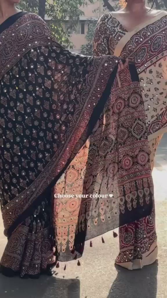 Product video showcasing Ajrakh inspired Modal Silk Real Mirror Work saree in multiple colour options, premium soft fabric, elegant drape and perfect for party wear, wedding and festive occasions for women.